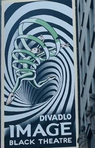 Black and grey images with figure in green running through the design showing the words Divadlo Image Black Theatre Streetart